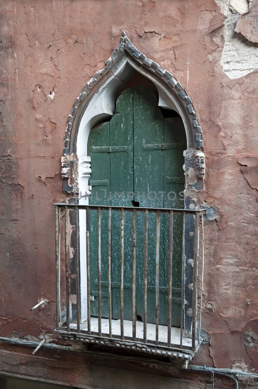 An old balcony door in Venice, Italy.