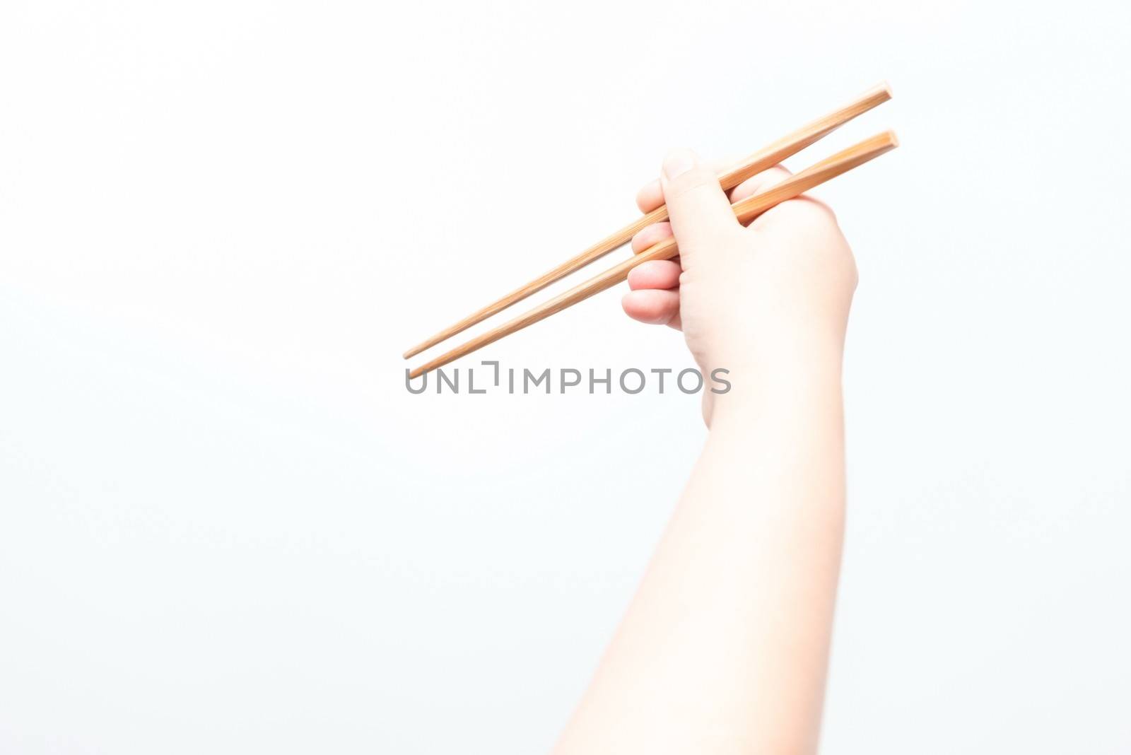 Asian woman holding brown chop stick by sasilsolutions