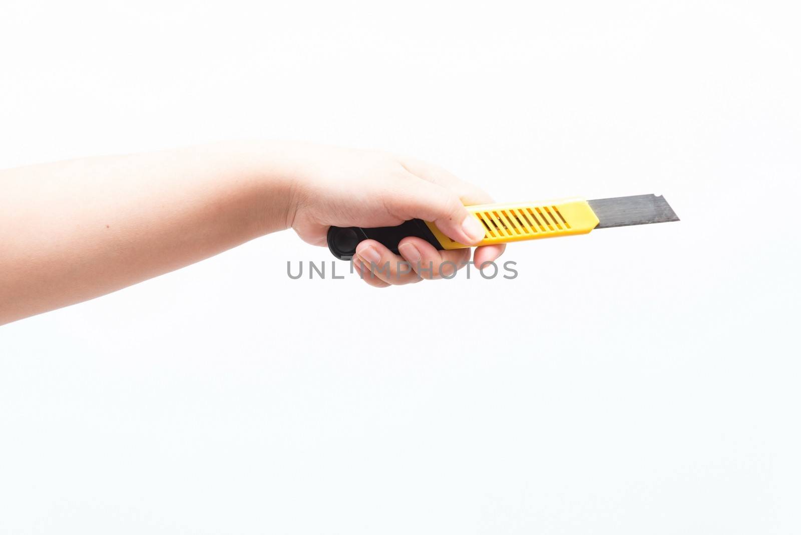 Asian woman holding a yellow box cutter knife, isolated