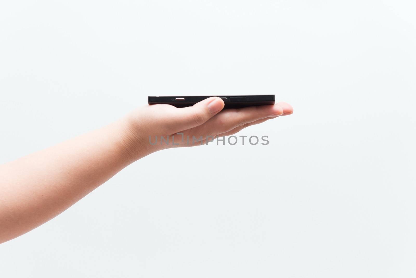 Asian woman holding black electronic equipment, isolated