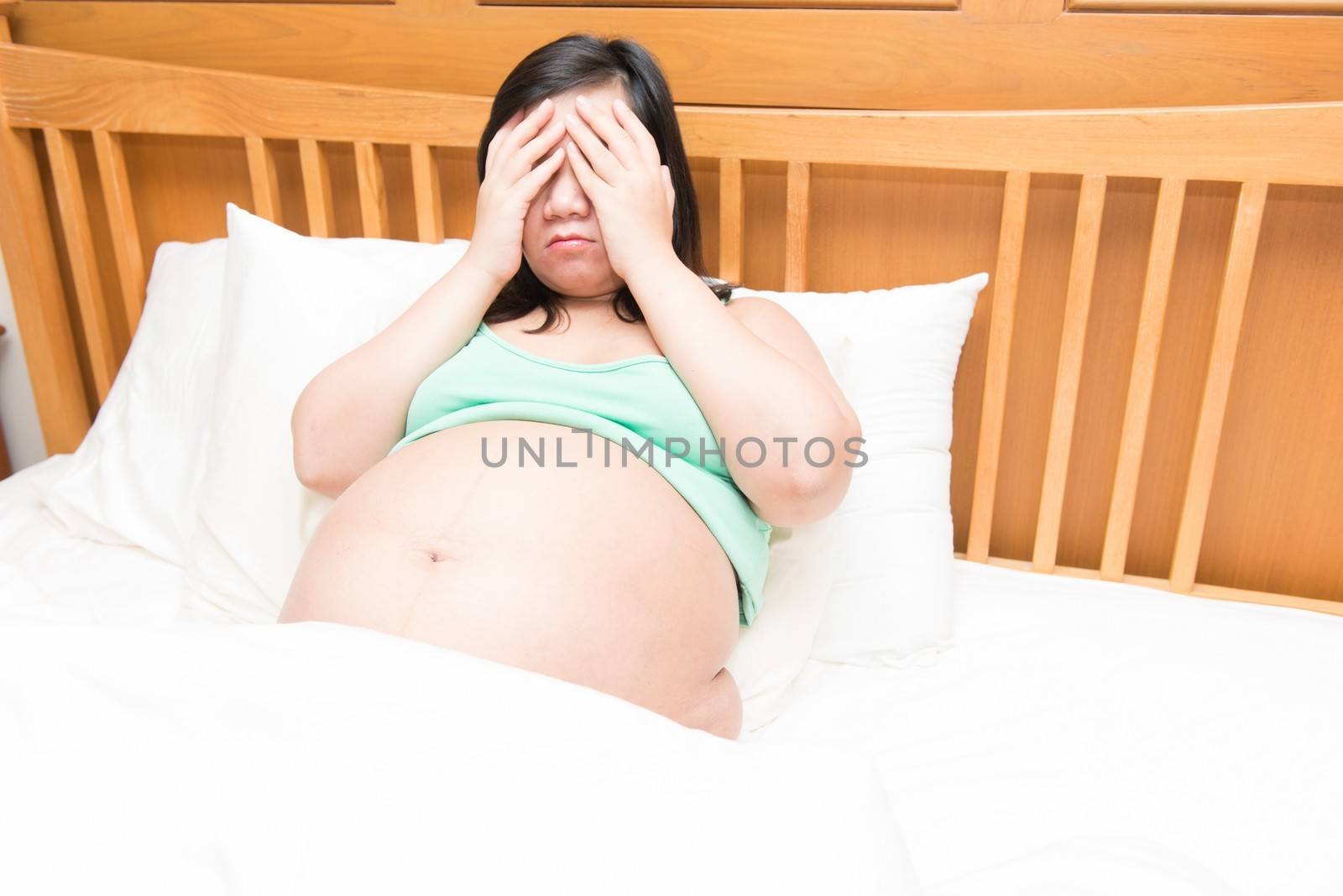 Young thai pregnant woman under stress by sasilsolutions