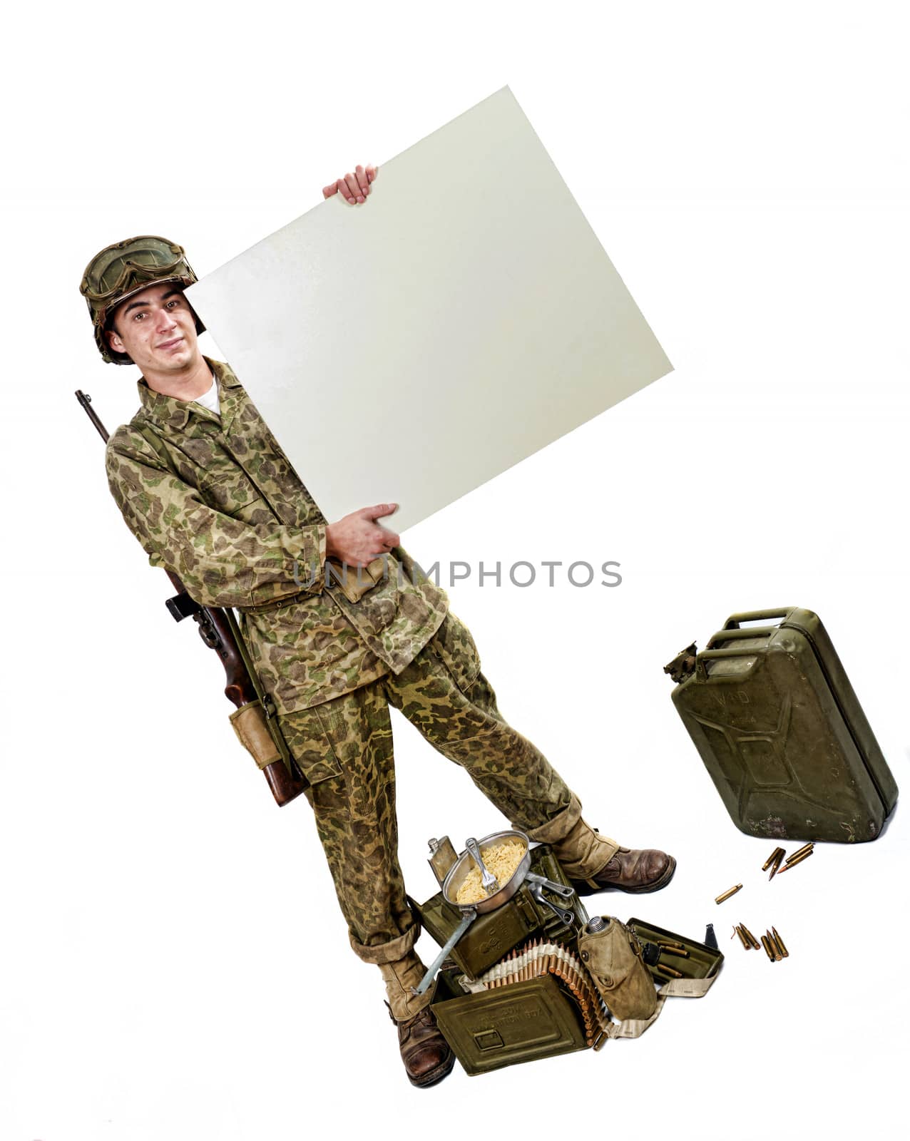 young American soldier in camouflage uniform shows a sign