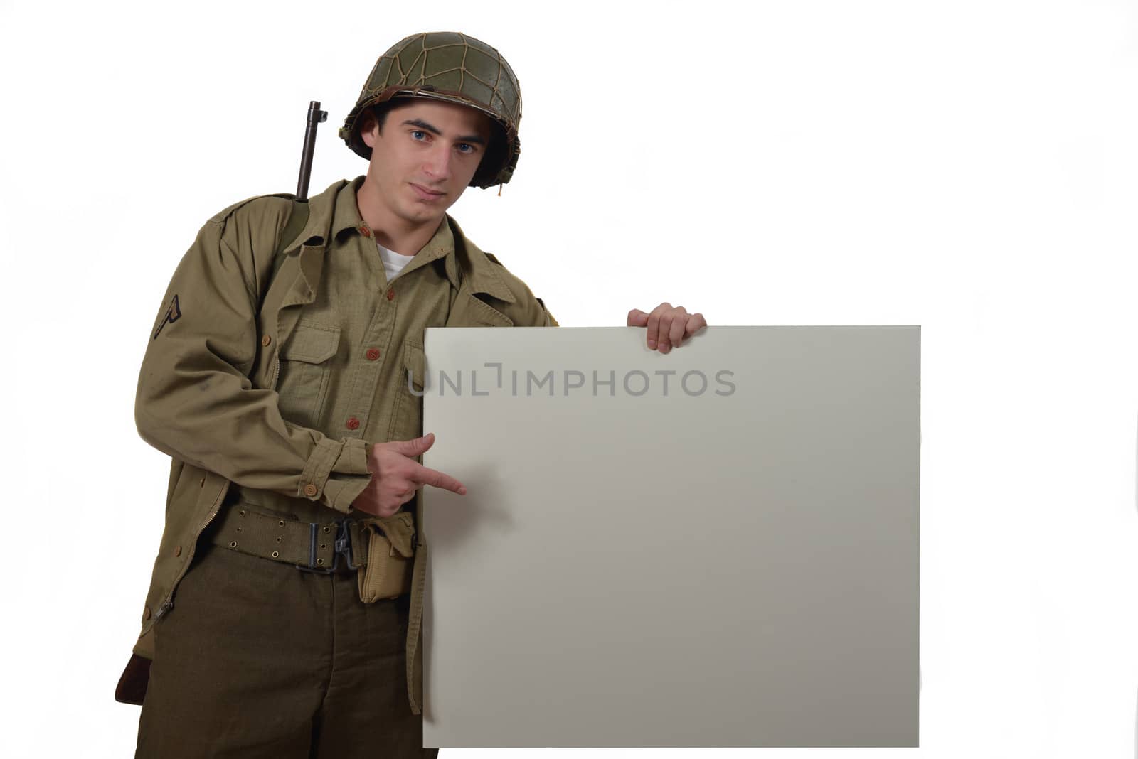 young American soldier shows a sign by philipimage