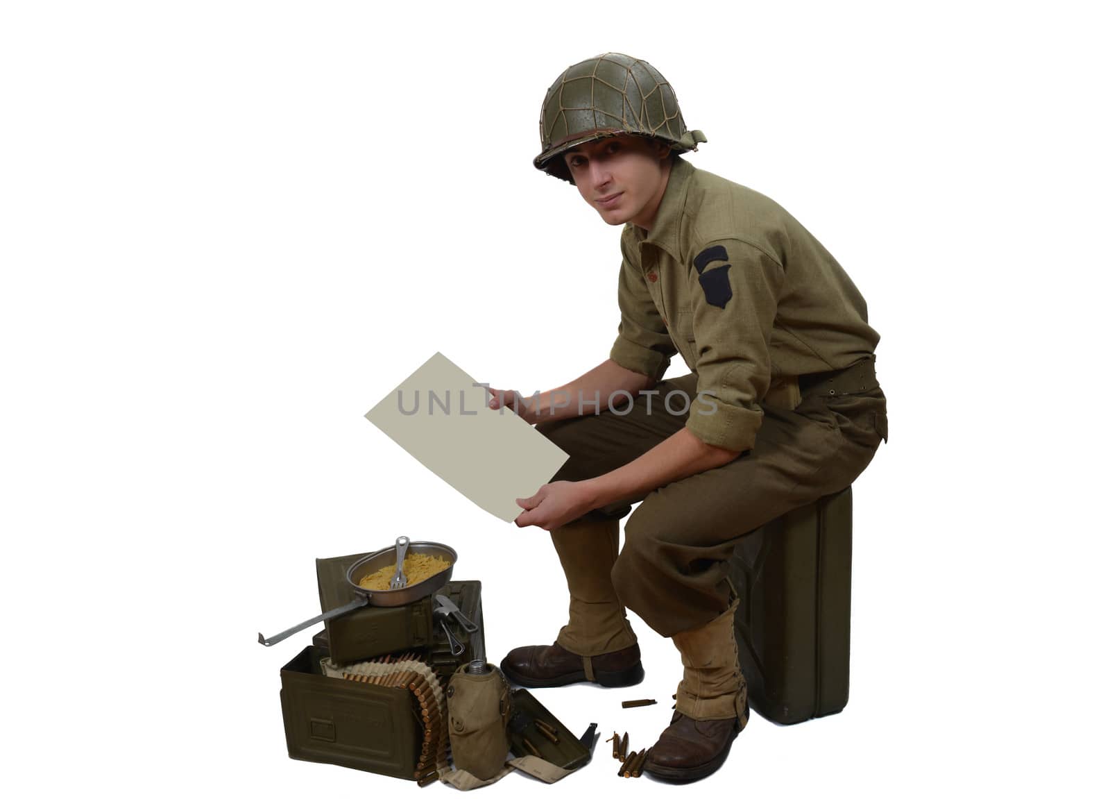 American soldier with M1 helmet shows a letter