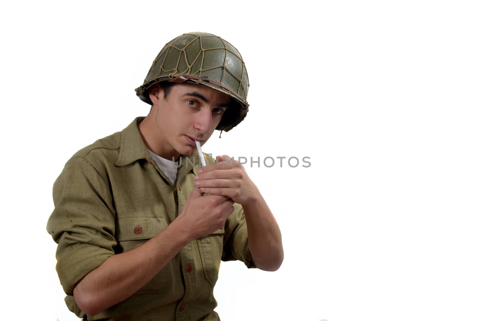 American soldierwith M1 helmet   lights a cigarette