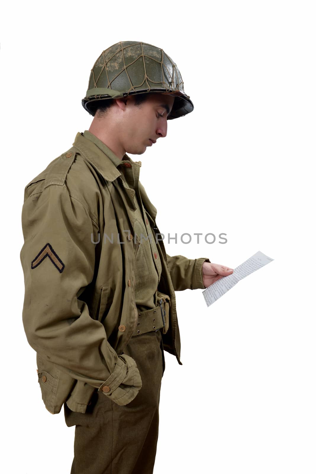 american soldier read a letter, he have M1 helmet