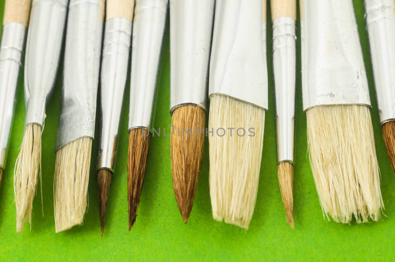 New Wooden Different Paintbrush Set Texture over a Colored Background