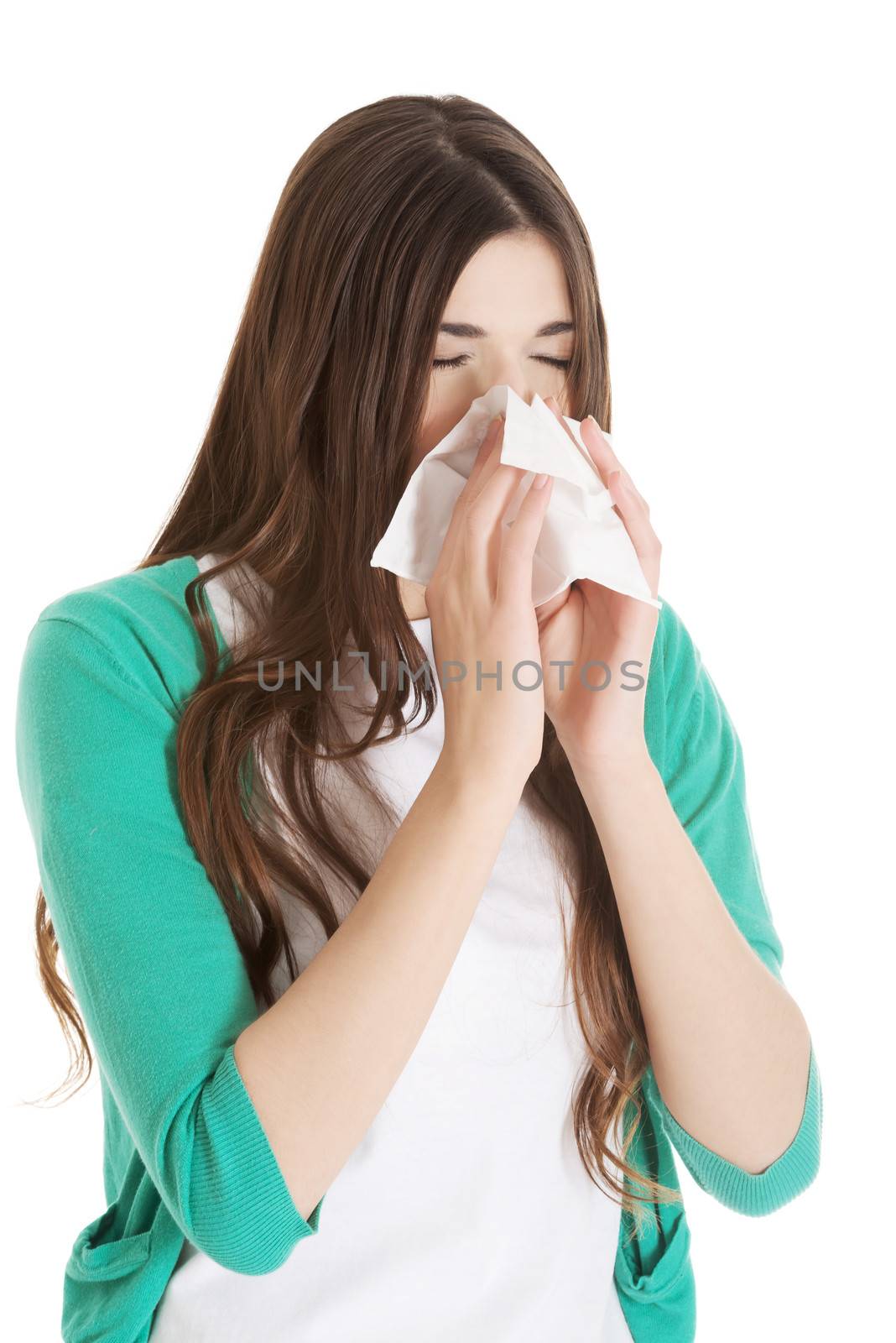 Young beautiful woman with tissue, handkerchief. Isolated on white.