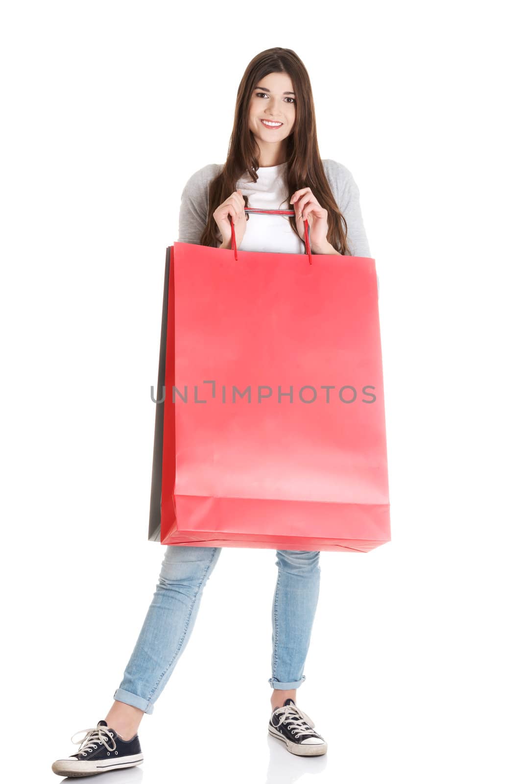 Young beautiful woman is shopping. by BDS