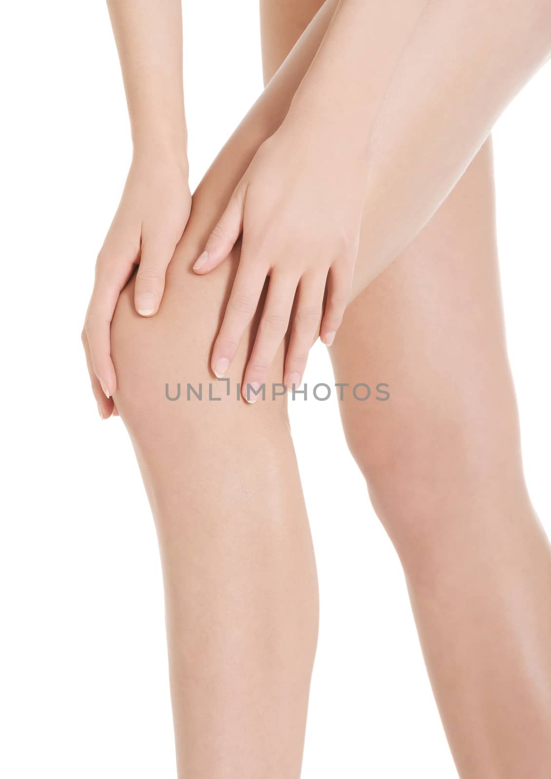 Woman's smooth knee, pampiering. Spa concept. Isolated on white.