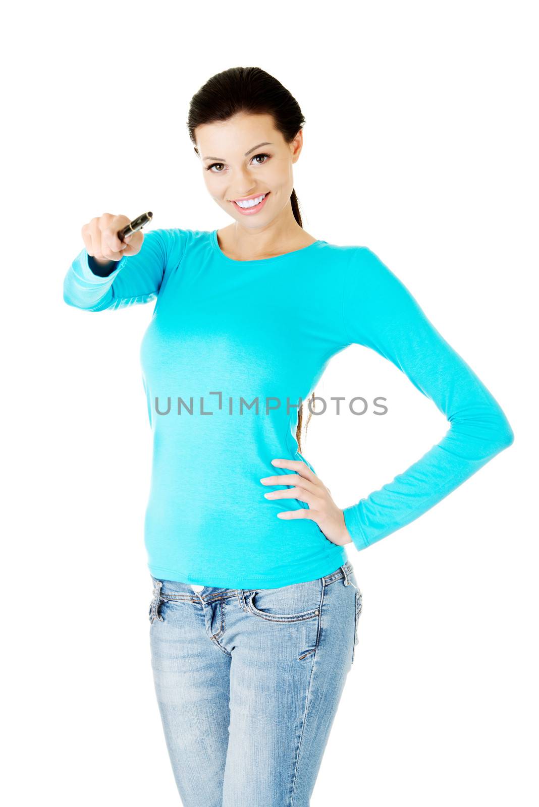 Beautiful casual woman holding pen. Isolated on white.