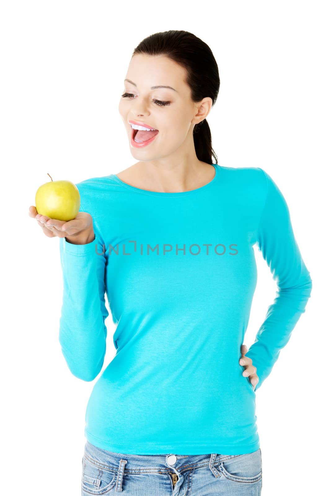 Young beautiful woman holding an apple. Isolated on white.