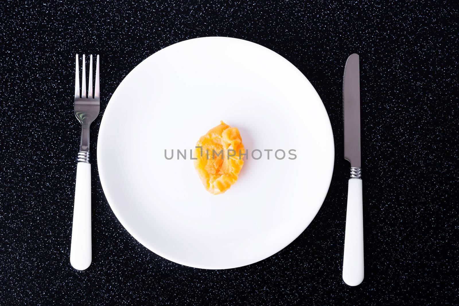 Dry apricot on a white plate.