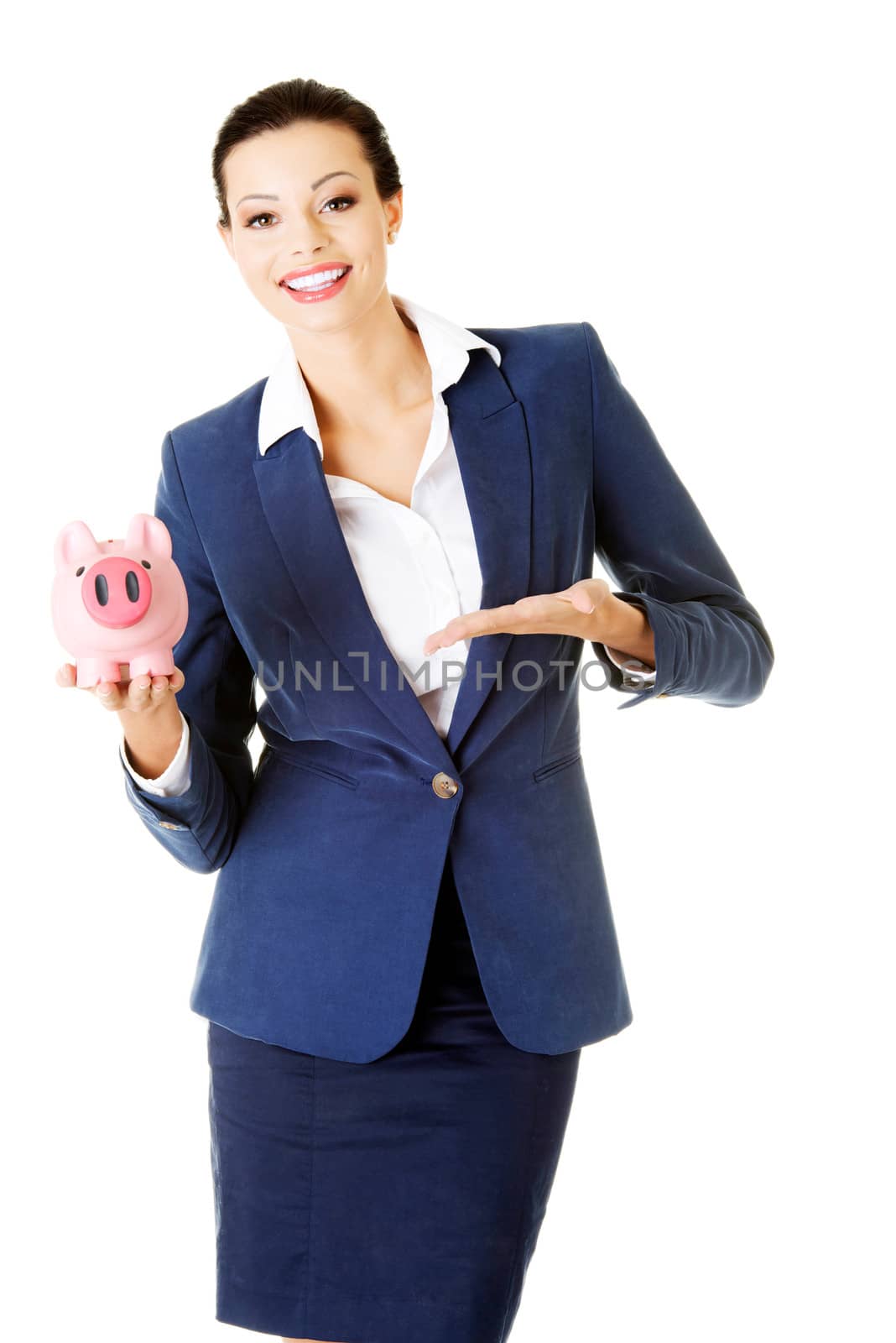 Young business woman holding piggy- bank. Isolated on white.