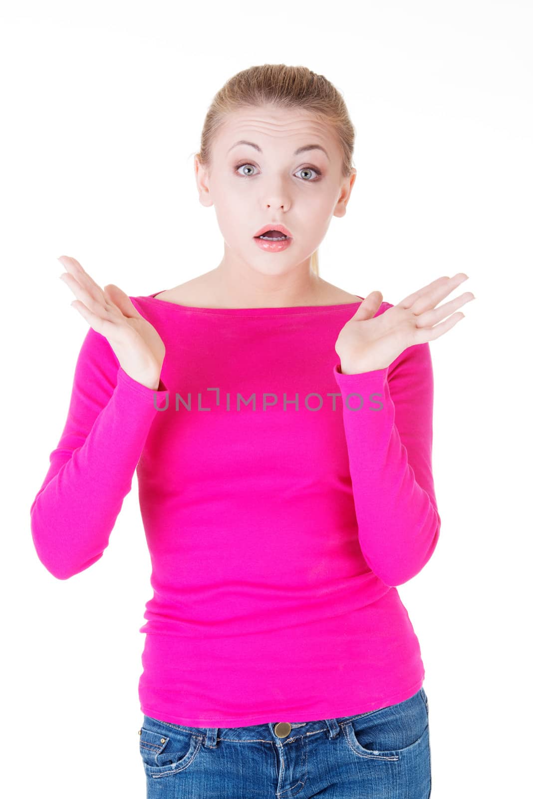 Young casual woman student expresses shock, surprise. Isolated on white.