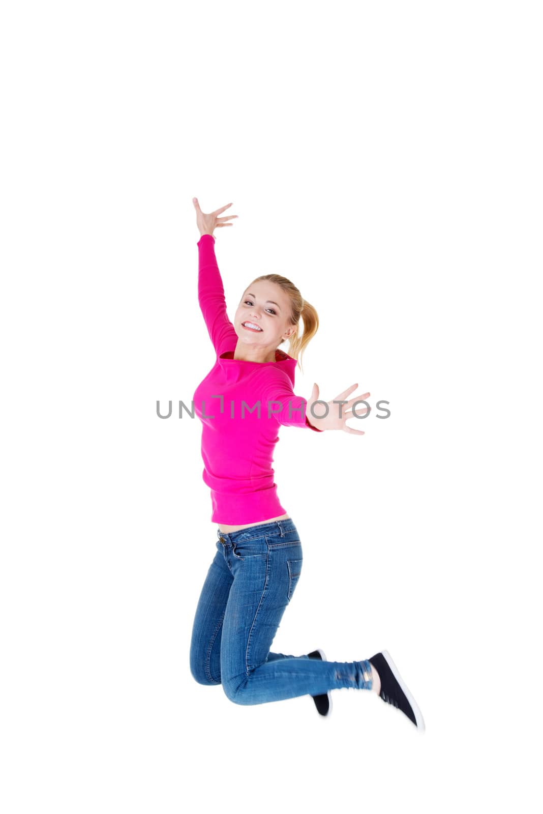 Young caucassian woman is jumping. Isolated on white.