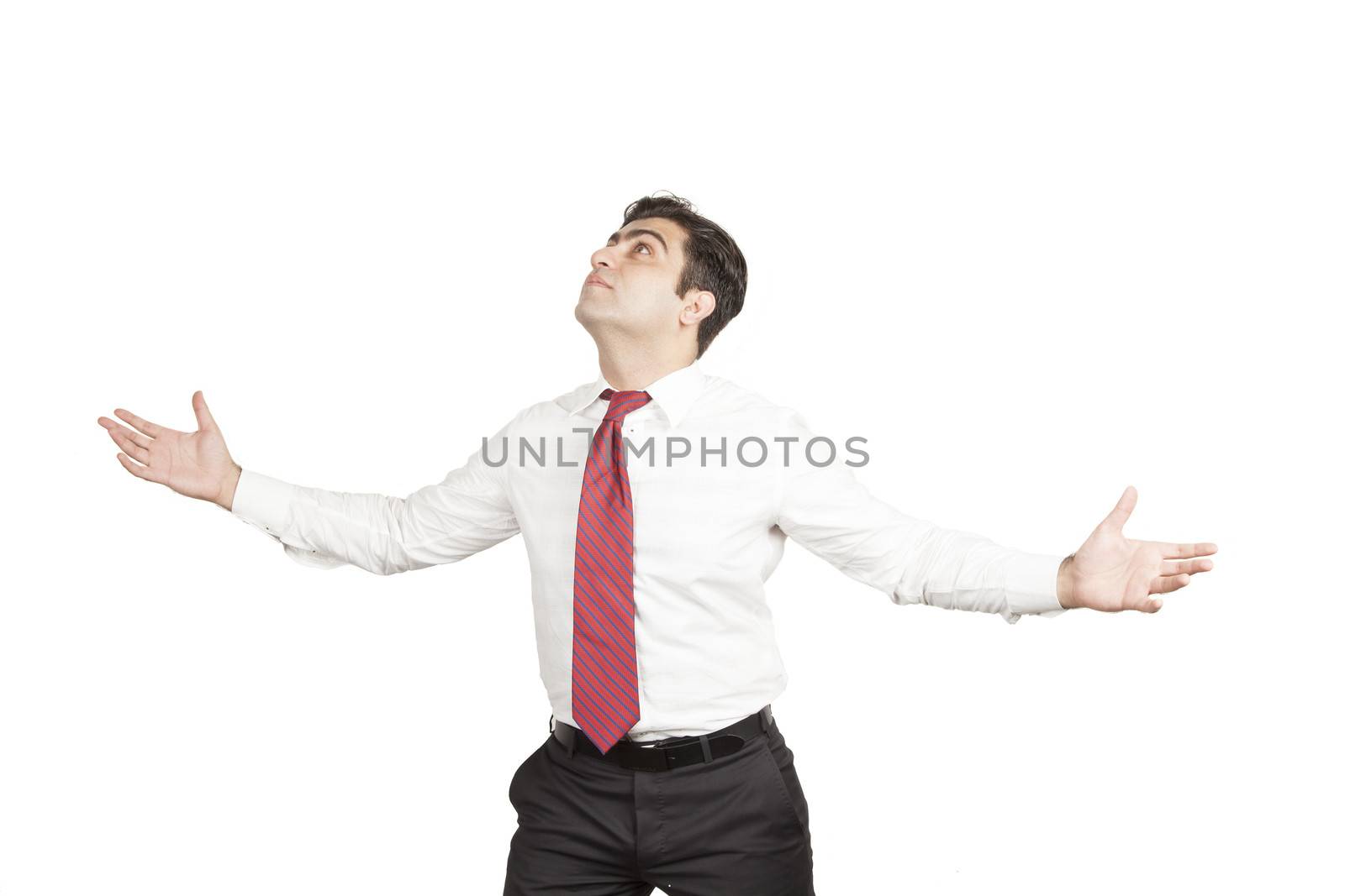 Man opening his arms wide open looking up