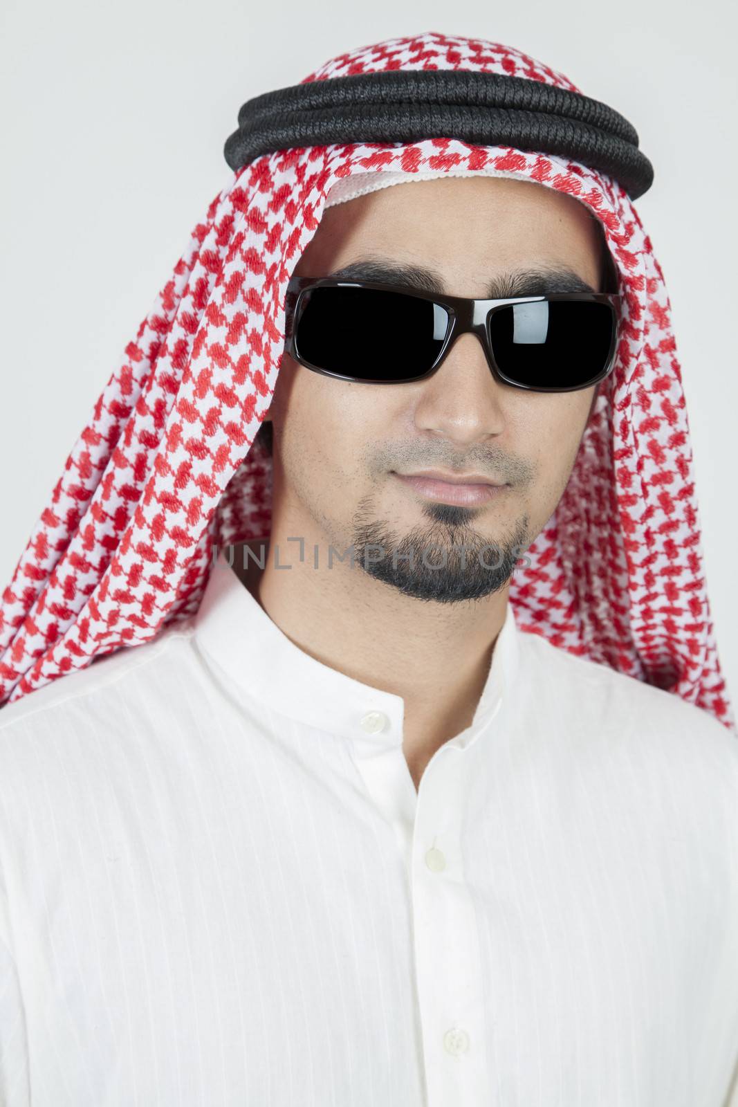 Young arab portrait wearing sun glasses by haiderazim