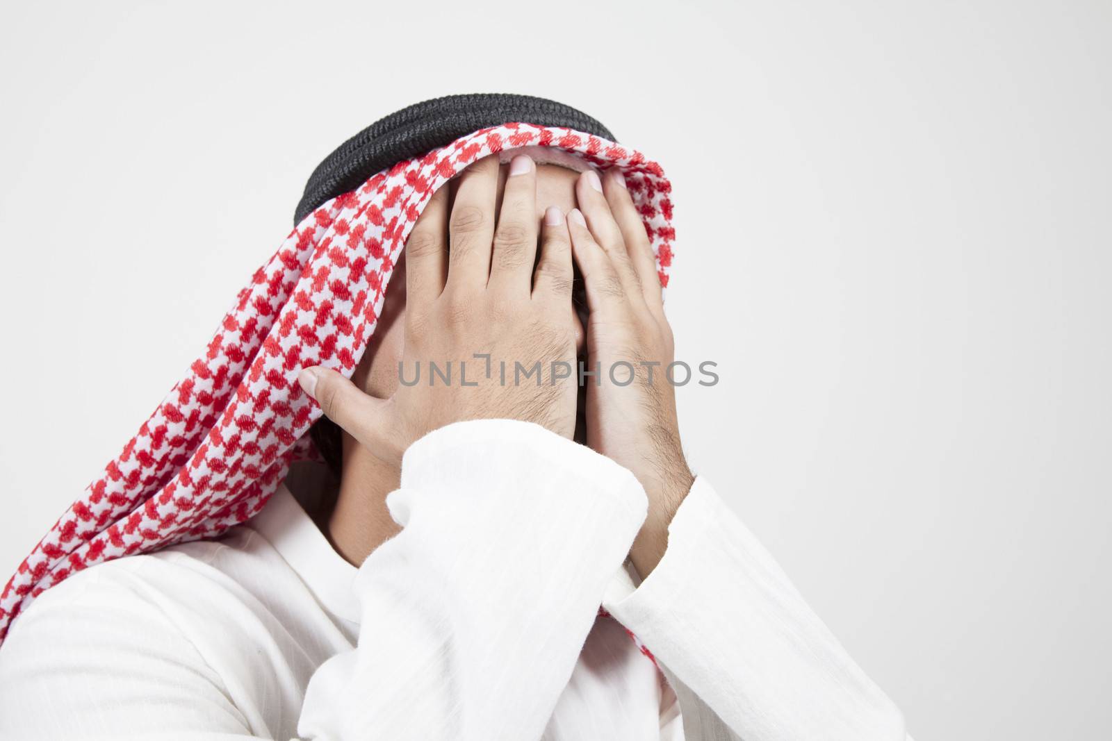 arab man covering his face by haiderazim