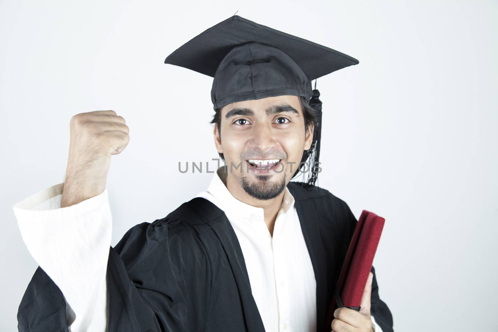 Asian student graduate raising his hand by haiderazim