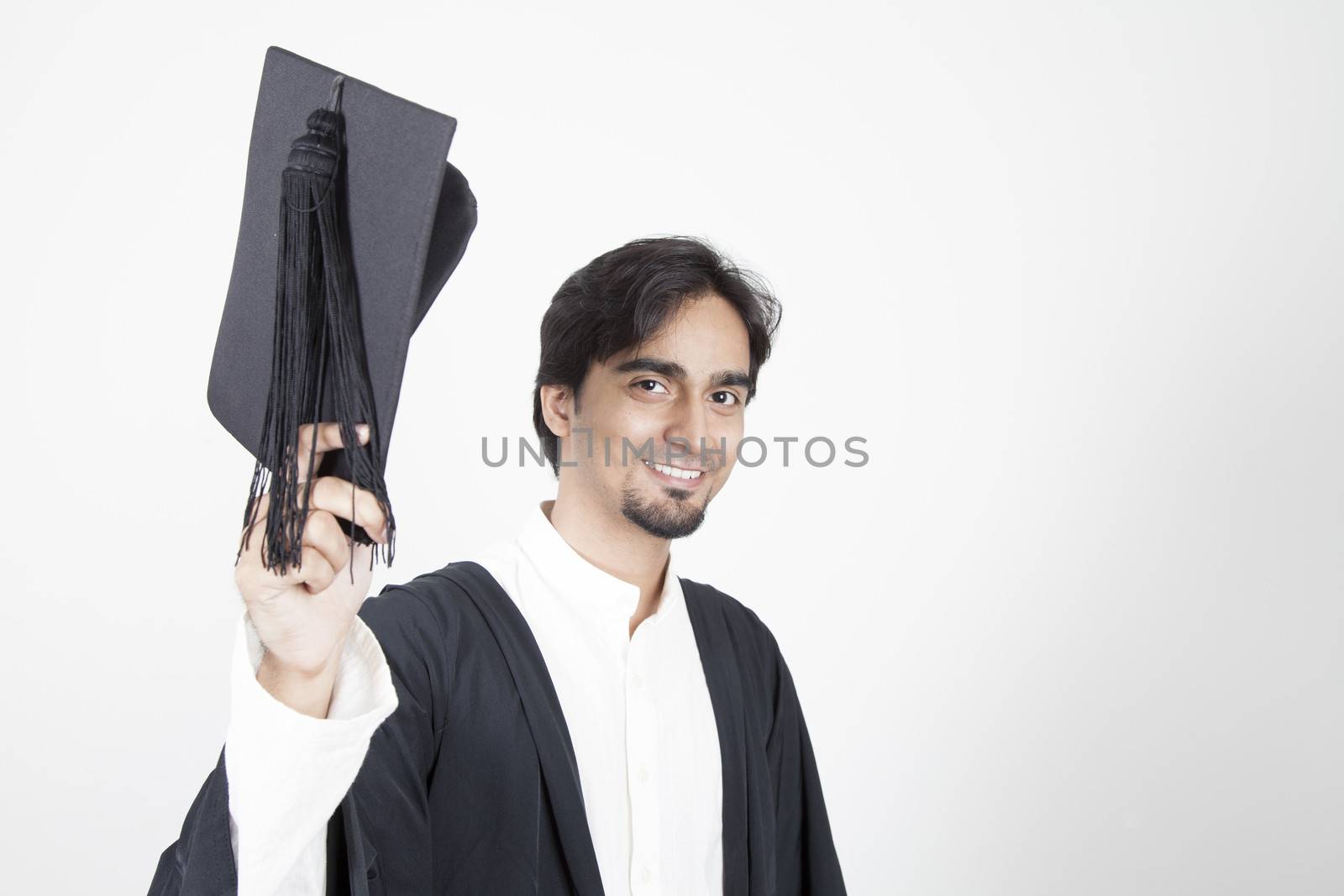 Asian student graduate raising his hat
