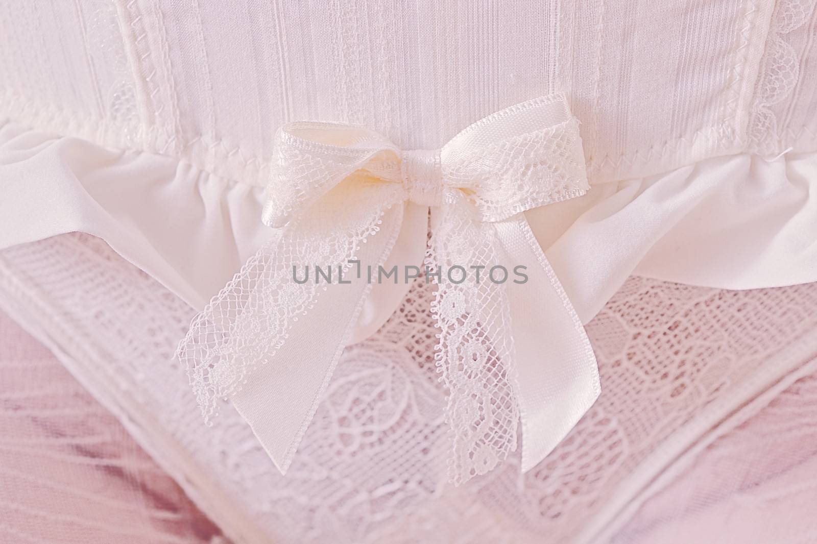 Close-up of white panties with ribbon