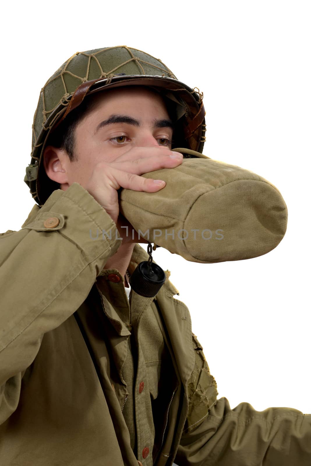 young american soldier drink  water in canteen