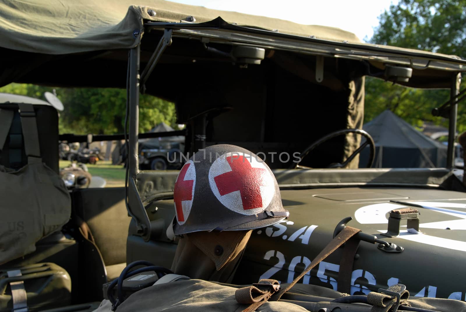 world war two helmet placed on the military truck with lot of equiments