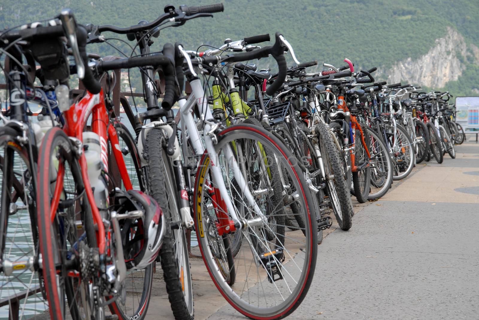 many bicycles parked on the side near mountain