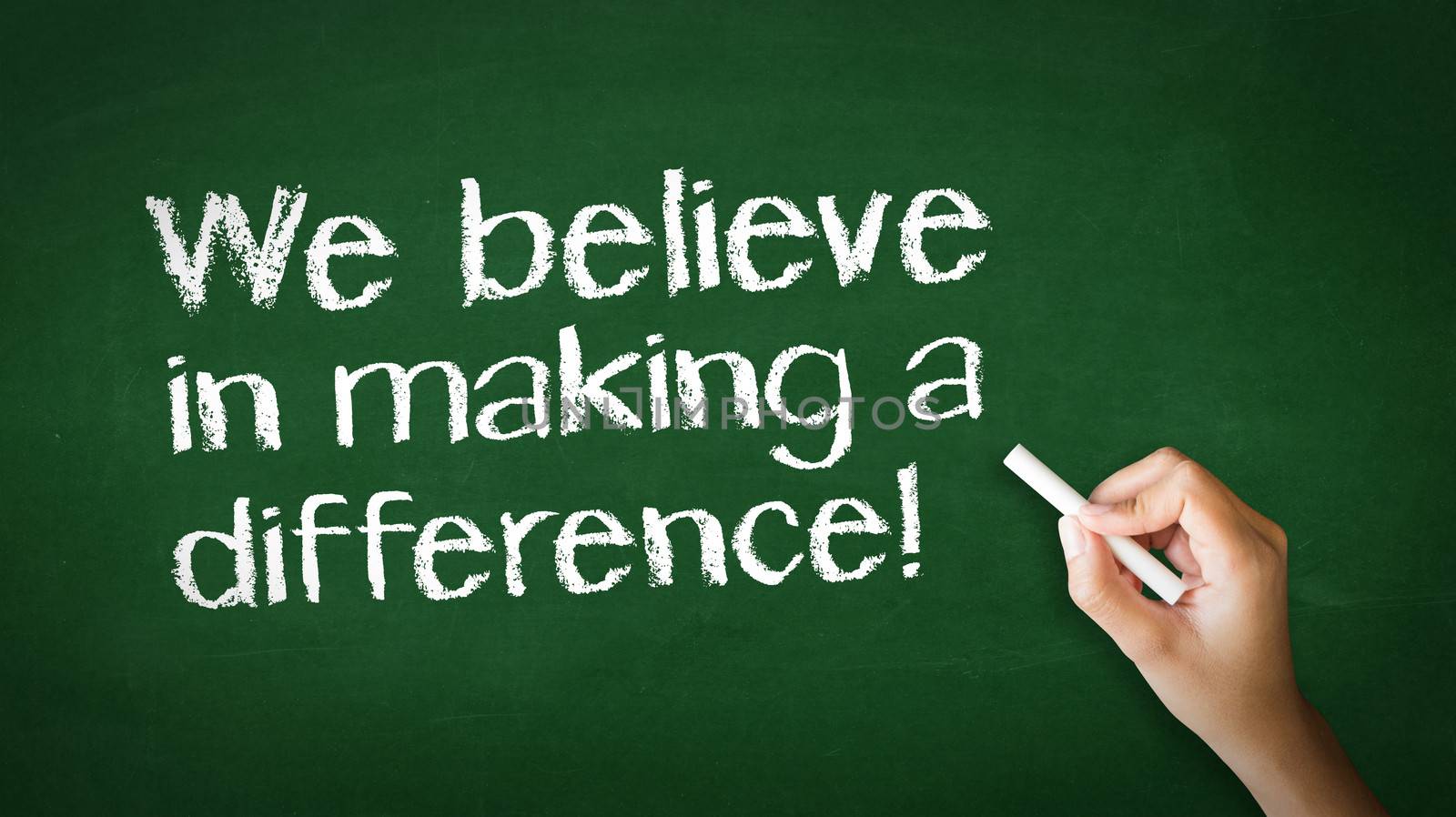 A person drawing and pointing at a We believe in making a difference Chalk Illustration