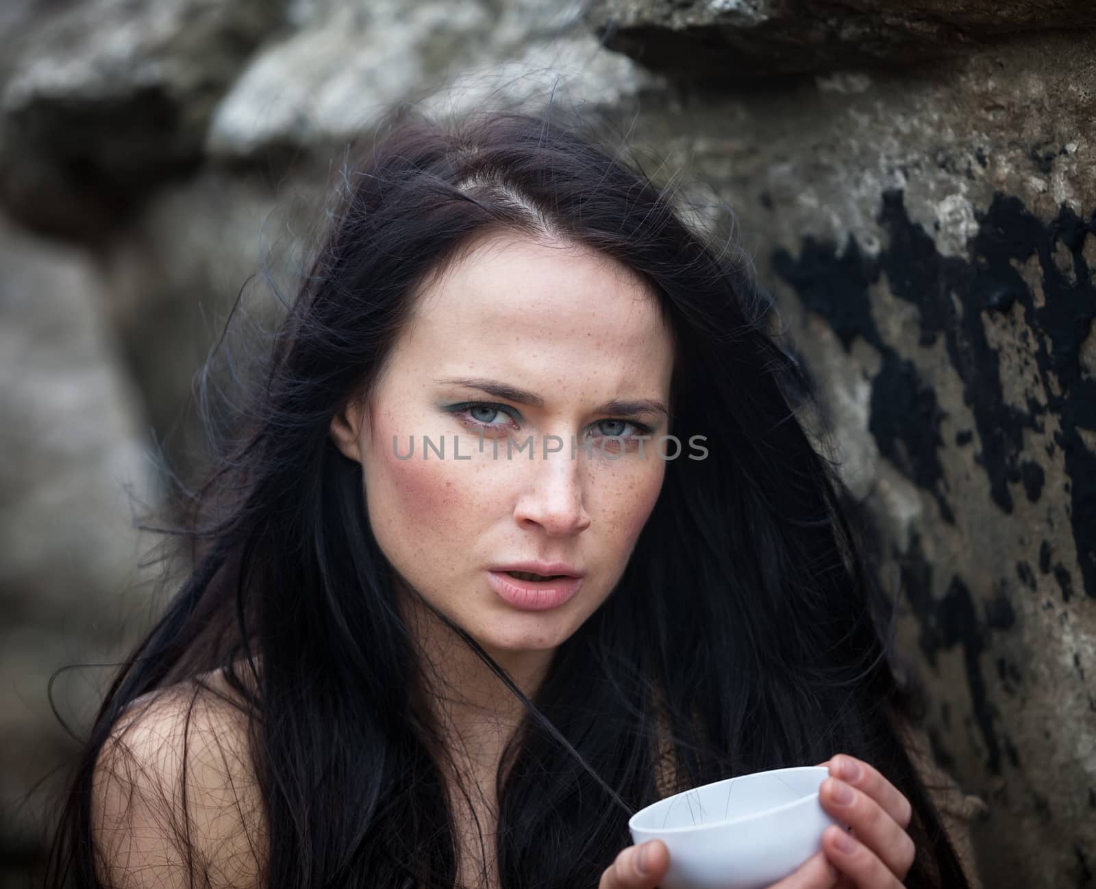 woman drinking tea outdoors by palinchak