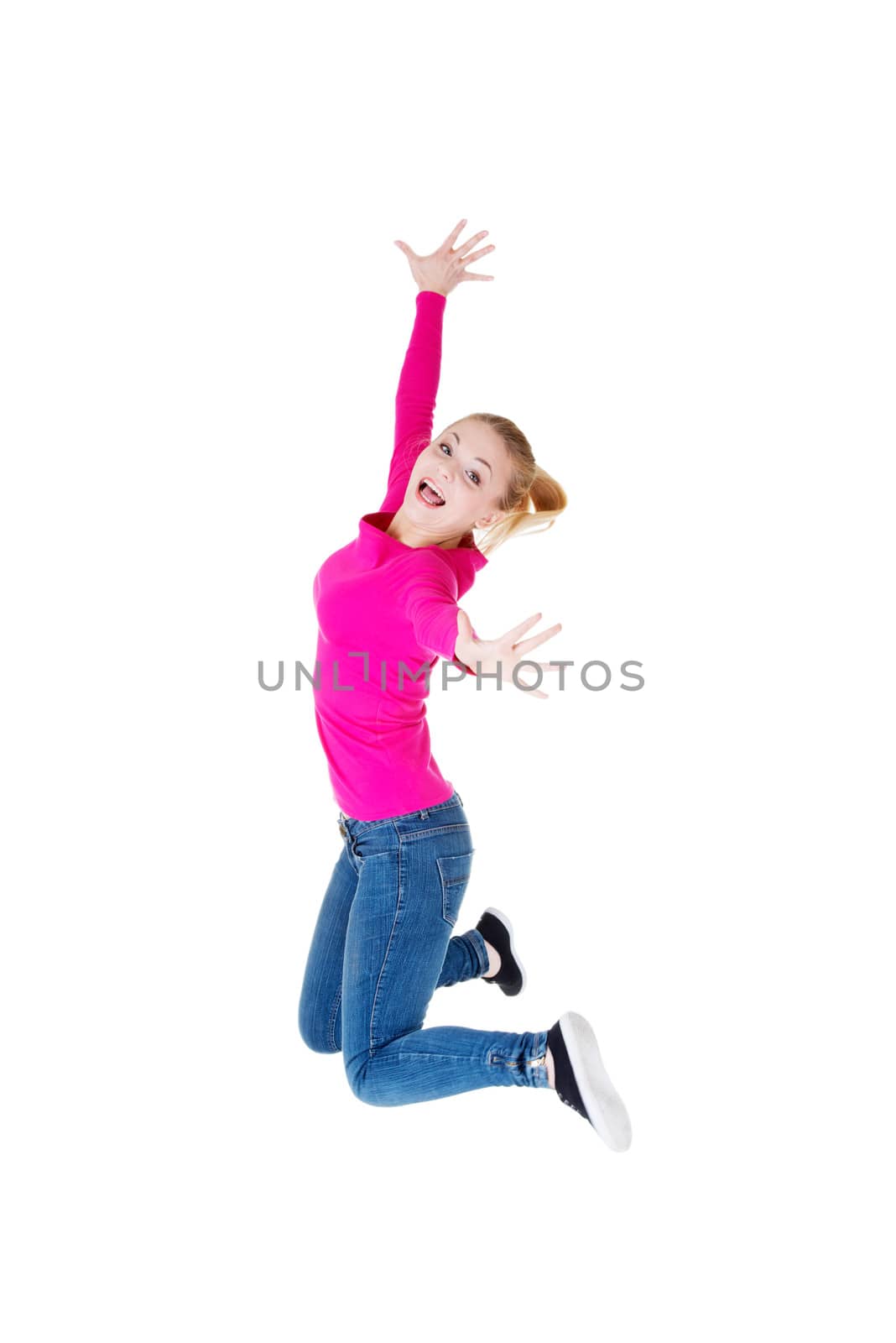 Young caucassian woman is jumping. Isolated on white.