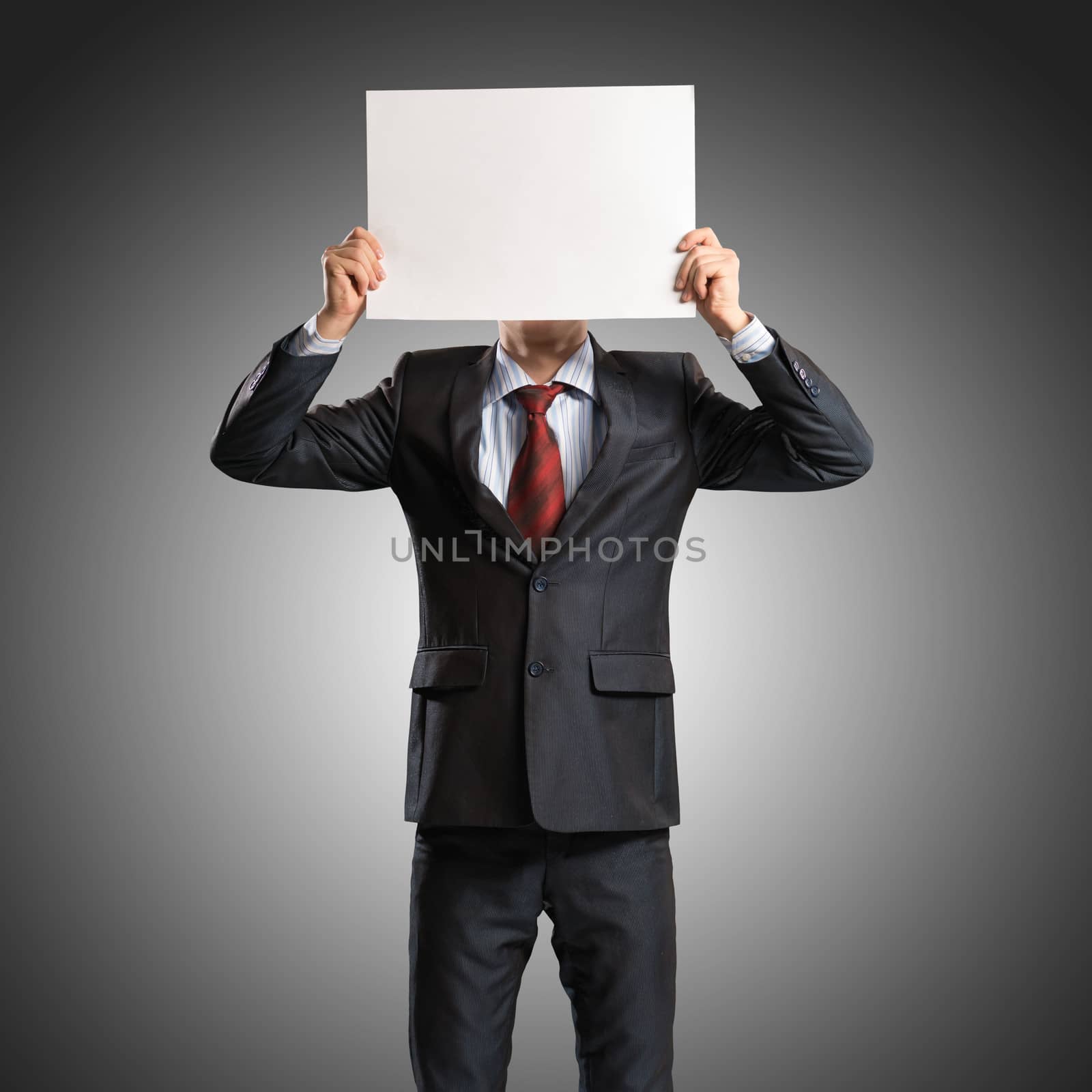 business man holding a poster, place for text