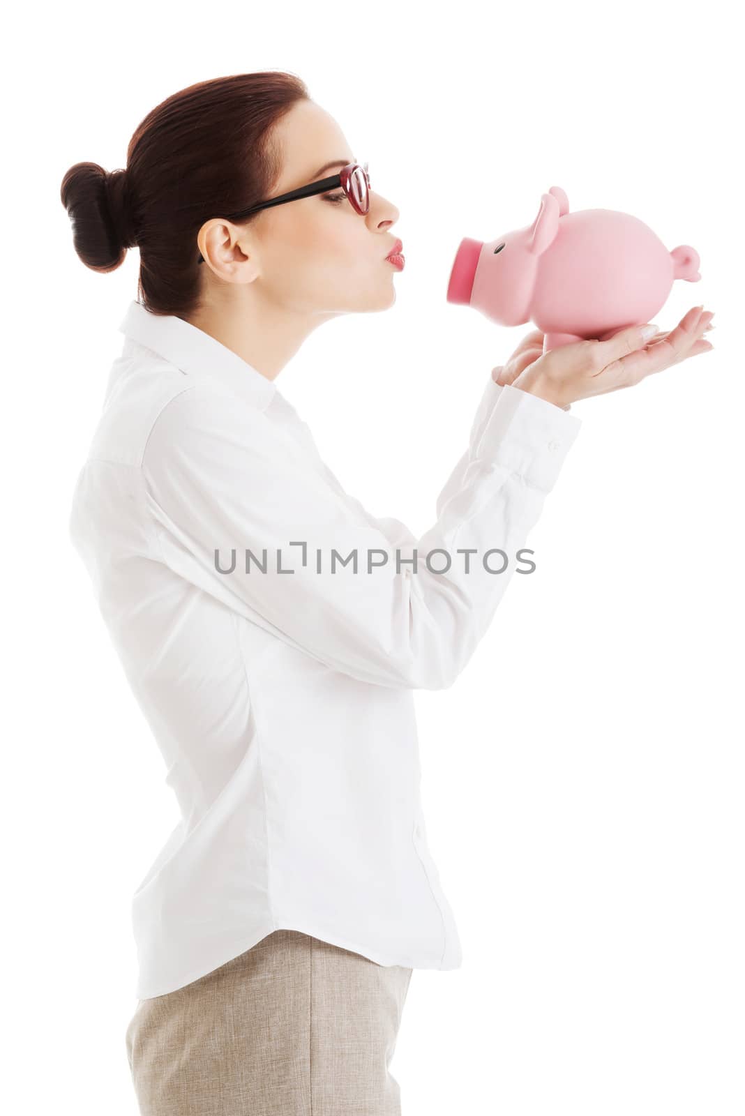 Beautiful business woman holding piggy-bank. by BDS