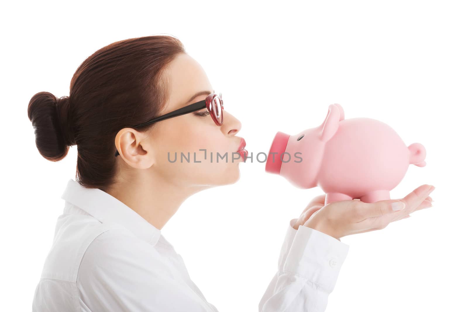 Beautiful business woman holding piggy-bank. Isolated on white.