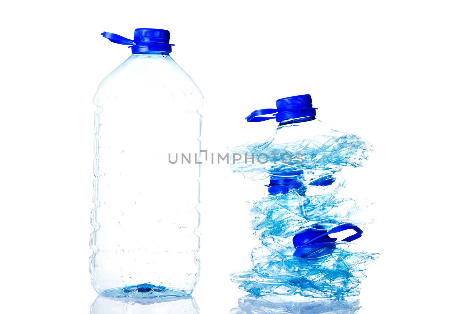 Plastic bottles prepared for recycling. Isolated on white.