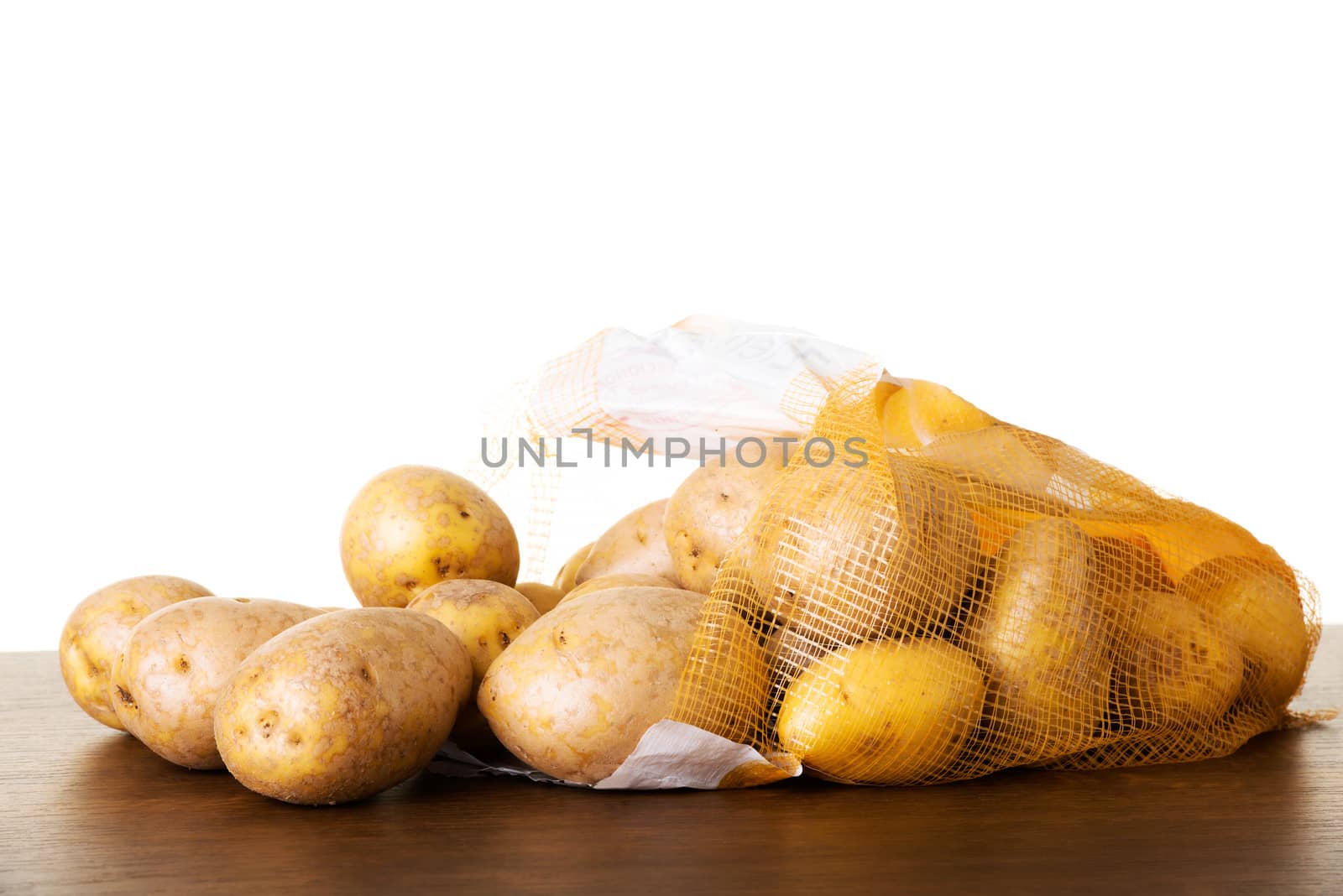 Fresh potatoes. Over white background.