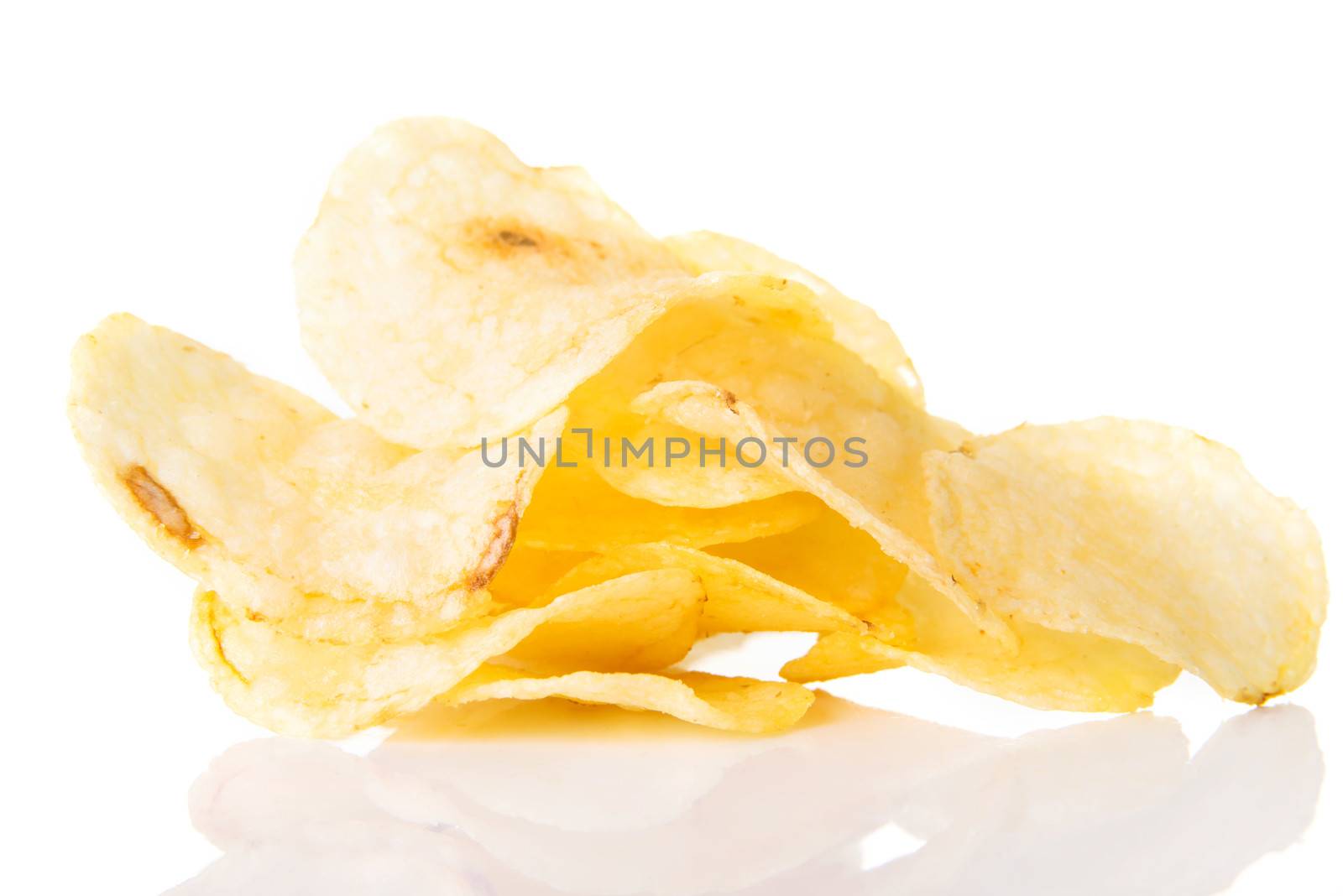 Yellow, tasty but unhealthy potatoe chips. Isolated on white.