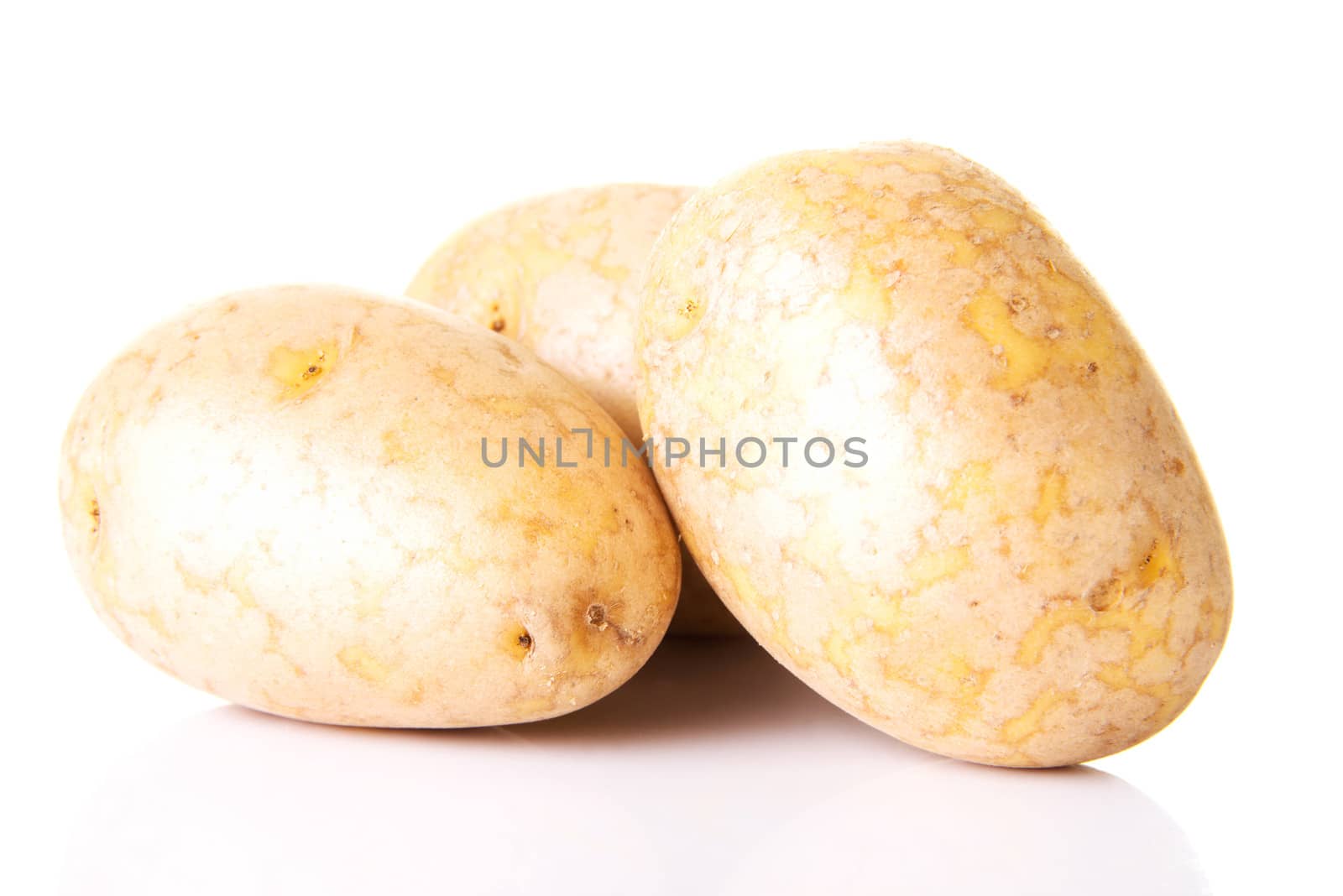 Fresh potatoes. Over white background.