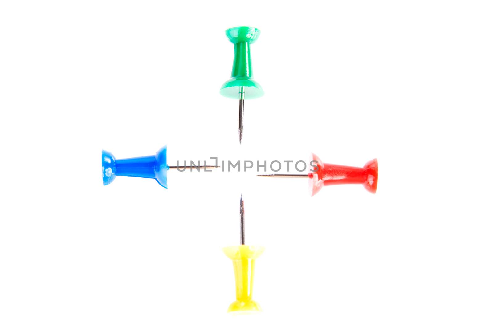 Four colorful drawing pins. Isolated on white.