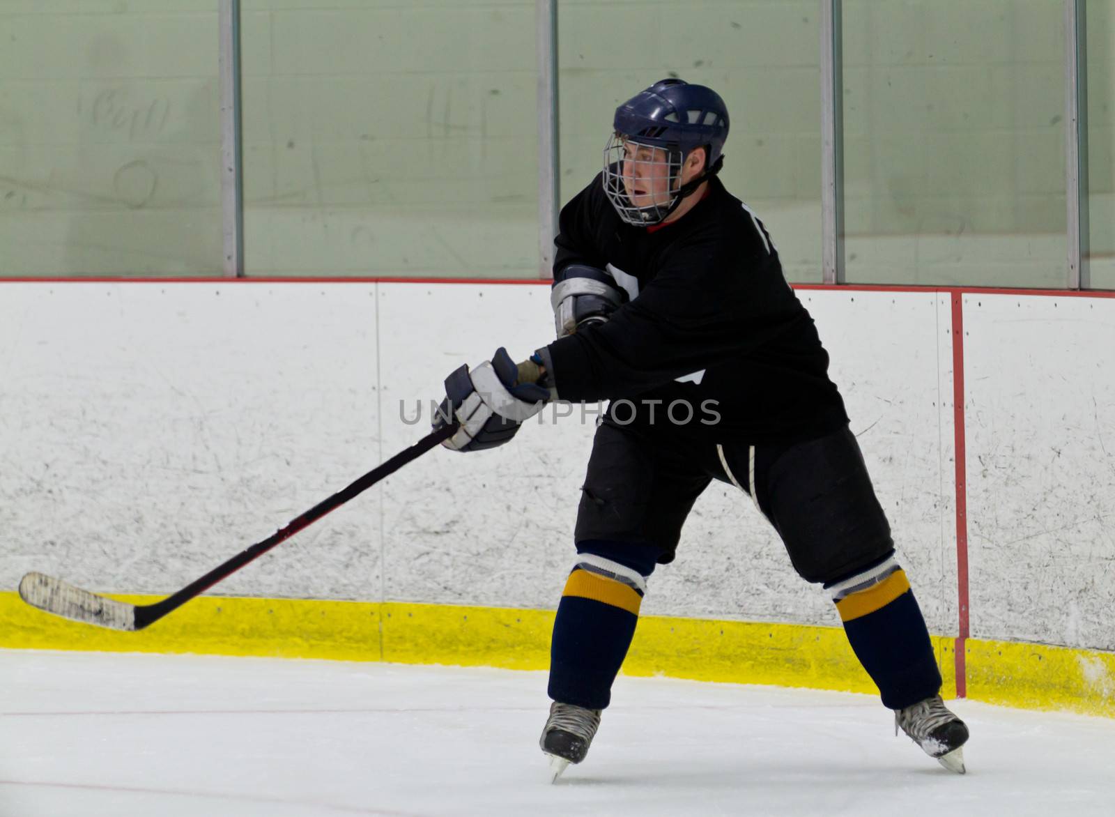 Hockey player taking a shot during a game by bigjohn36