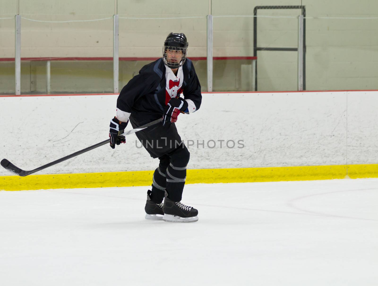 Male playing ice hockey