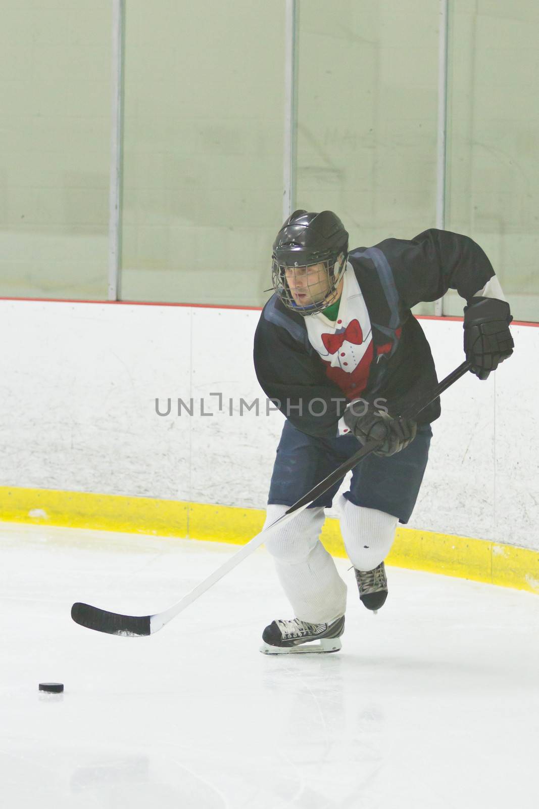 Hockey player skating with the puck
