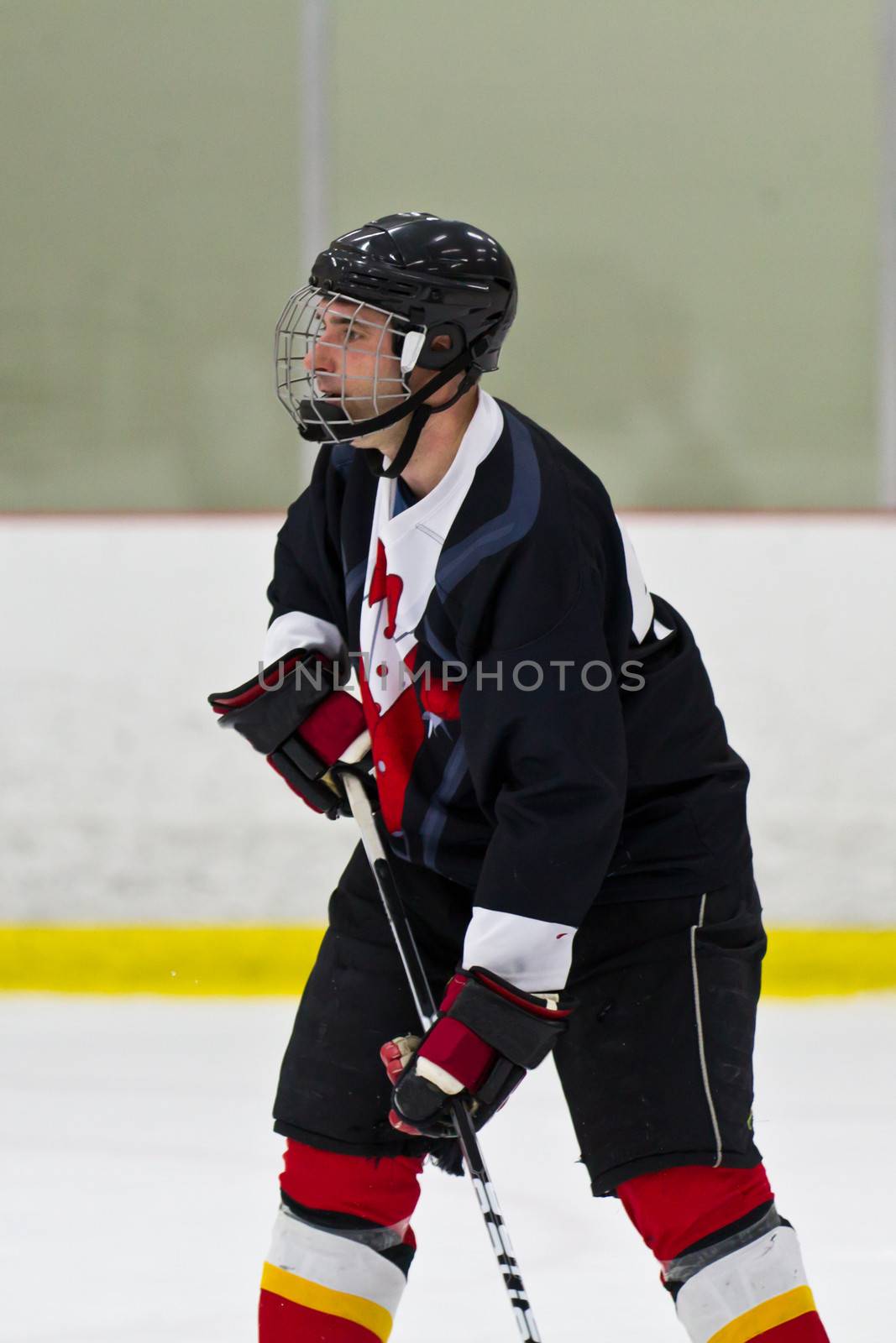 Hockey player in action during a game by bigjohn36