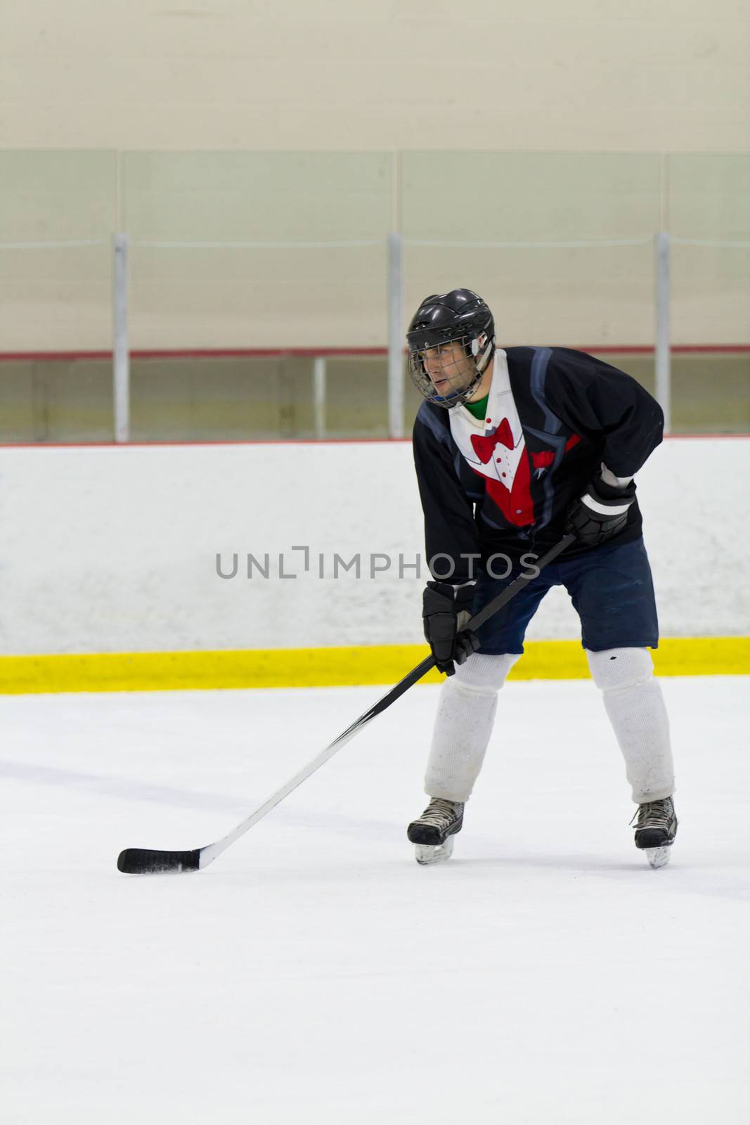 Hockey player ready for the drop of the puck by bigjohn36
