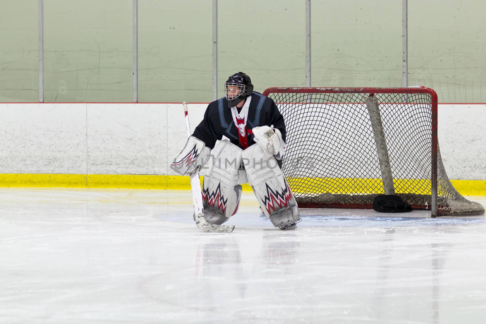 Goalie gets ready for the puck during an ice hockey game by bigjohn36
