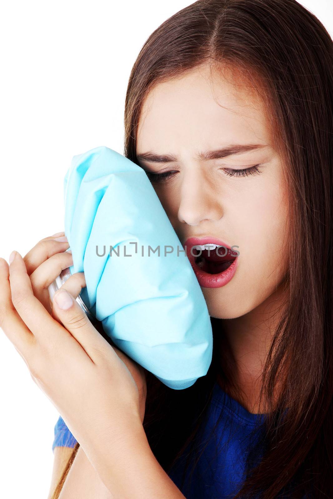 Young casual woman with toothache. Isolated on white.