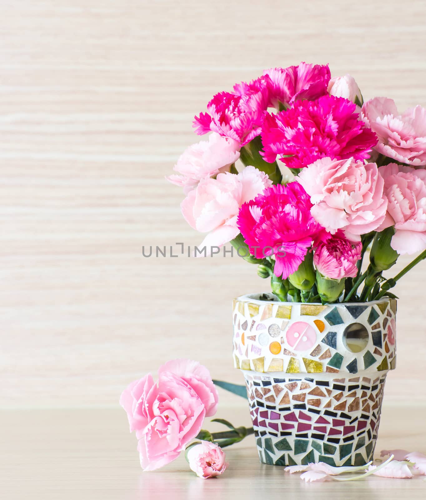 Carnation in mosaic flower pot