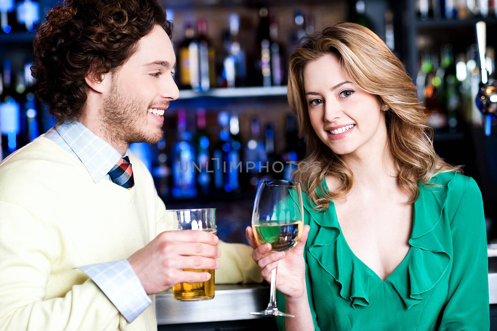 Let's celebrate. Young couple at nightclub by stockyimages