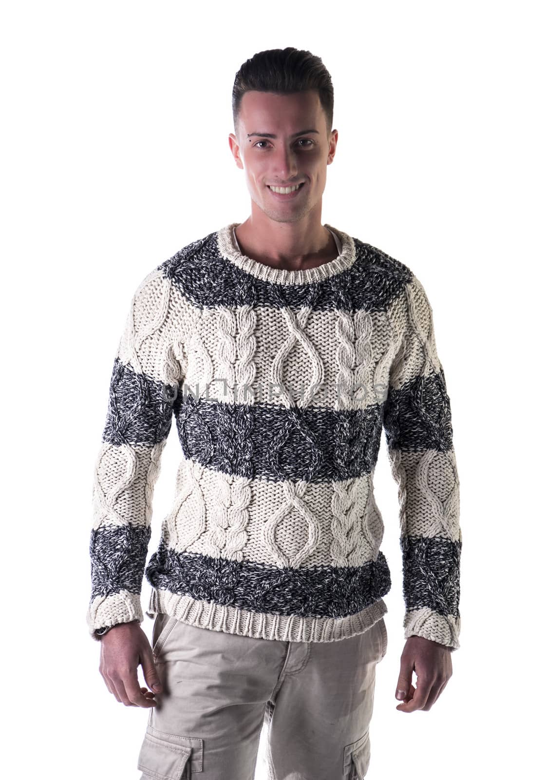 Good looking young man standing, wearing winter sweater by artofphoto